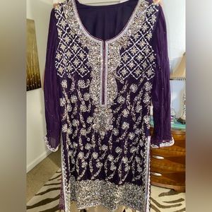Purple shirt with heavy work paired with jamawar trouser and chiffon dupatta.